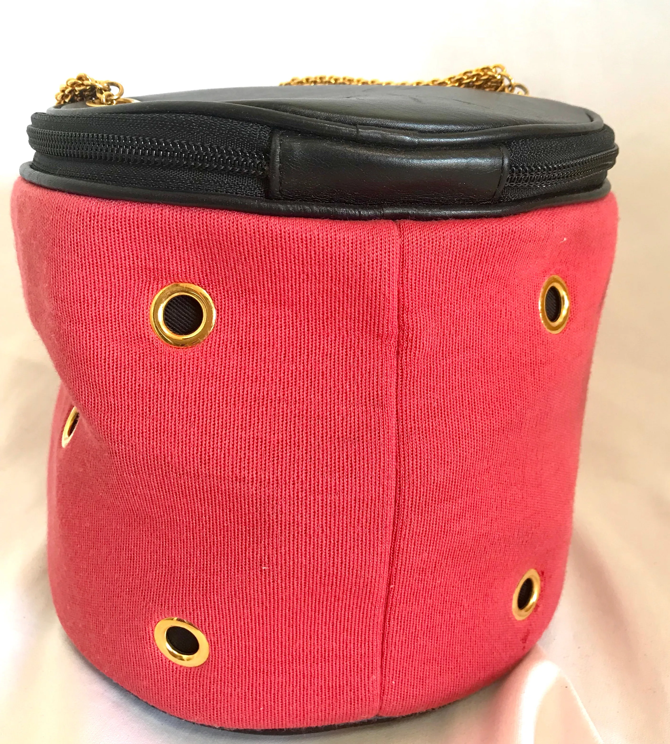 Vintage Moschino by Redwall lunchbox design red jersey and black leather handbag with golden eyelets and ball charms. 0506289
