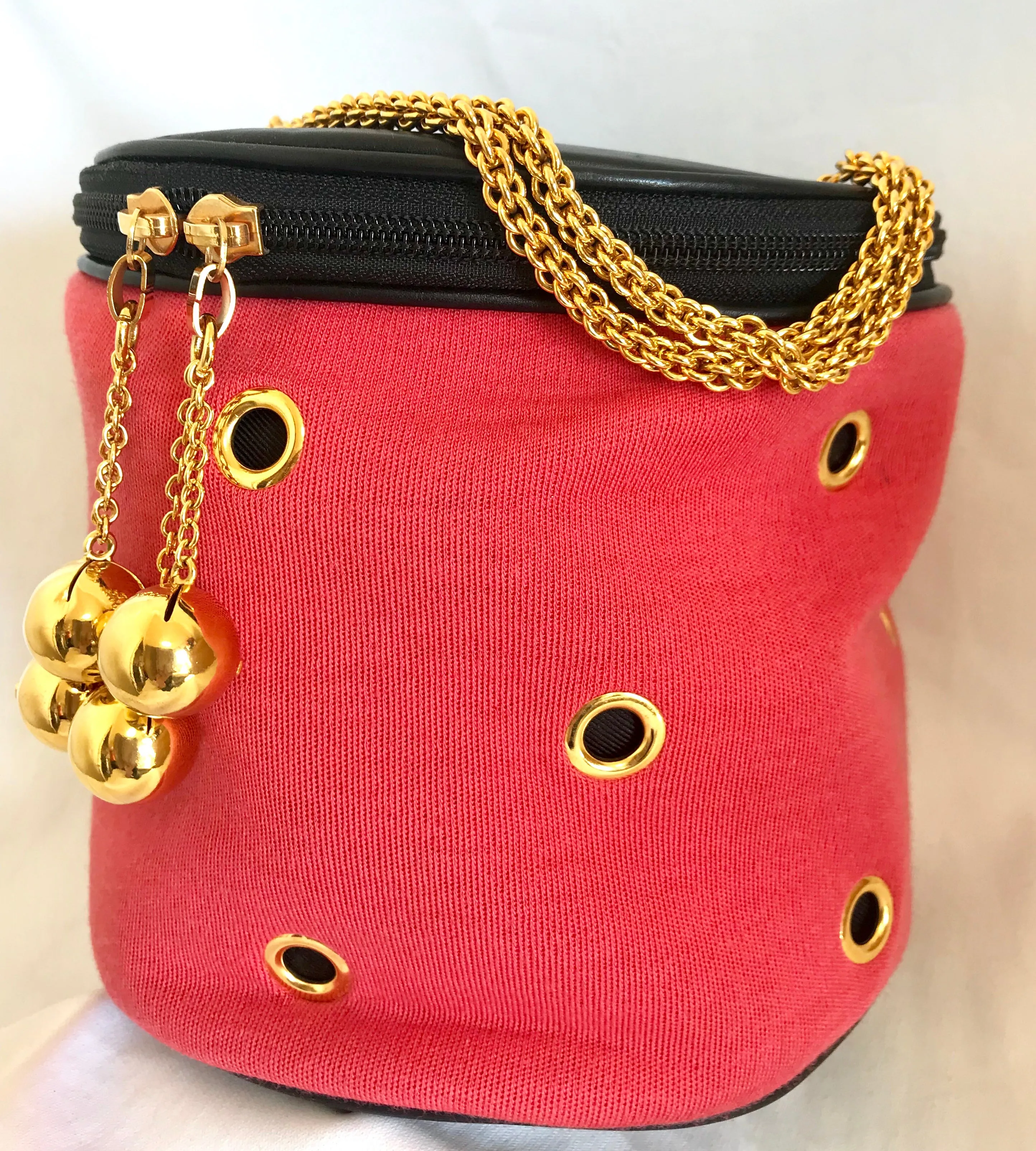 Vintage Moschino by Redwall lunchbox design red jersey and black leather handbag with golden eyelets and ball charms. 0506289