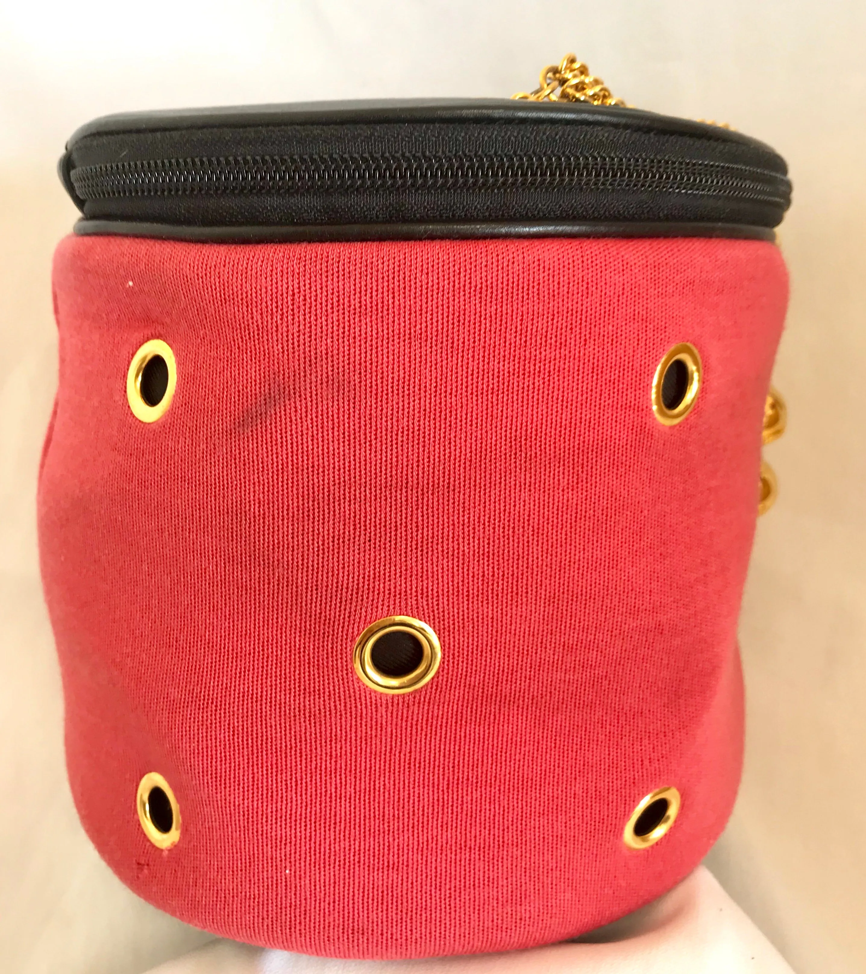 Vintage Moschino by Redwall lunchbox design red jersey and black leather handbag with golden eyelets and ball charms. 0506289
